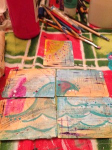 tiny work on mini-canvases of playing cards that create one image.